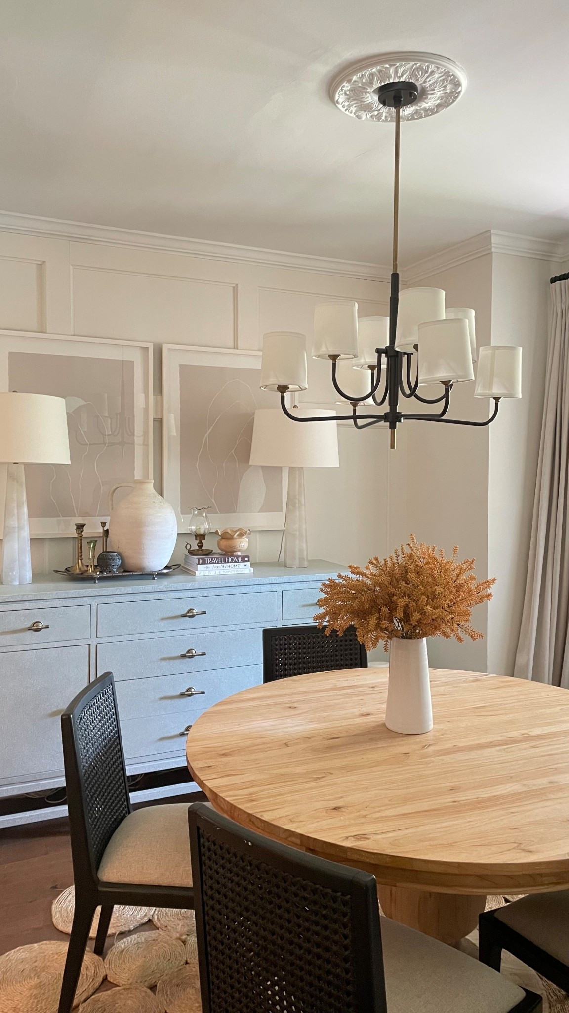 Dining room sources: round wood table, black dark wood cane back upholstered dining chairs, transitional modern chandelier

#LTKHome