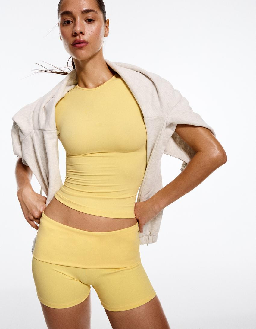 Technical Bermuda shorts with turn-up waistband - Trousers - Women | Bershka UK