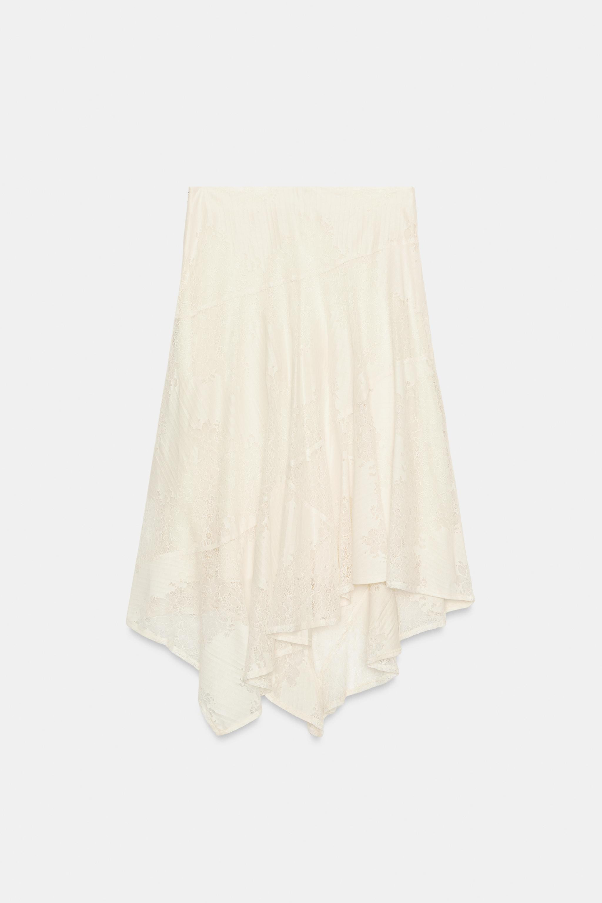 Mid-waist midi skirt with an elasticated waistband. Featuring an asymmetric hem and matching inte... | Zara DE