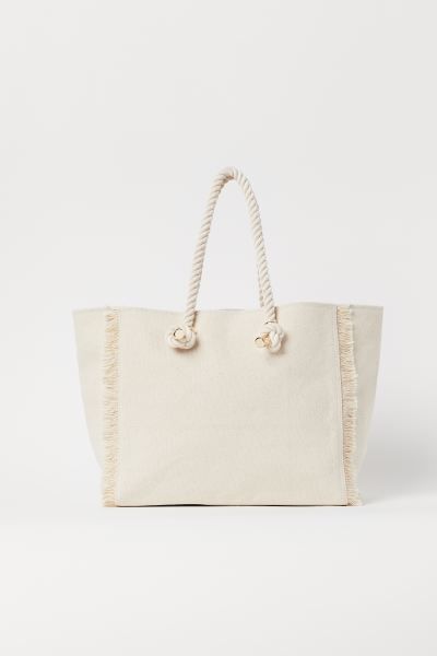 Shopper in cotton canvas with fringing down the short sides, two rope handles at the top with met... | H&M (UK, MY, IN, SG, PH, TW, HK)