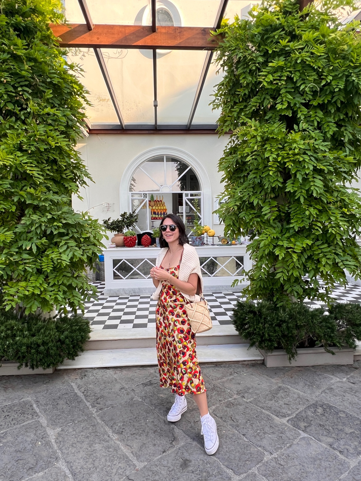 Printed silk slip dress with high top co bc rede and cotton sweater. Sezane straw bucket bag 

#LTKshoecrush #LTKstyletip #LTKeurope