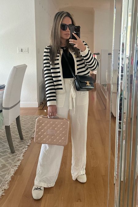 Spring styling. Classic style outfit of the day. Wool blend stripe cardigan. Black tank top. White draw string pants. Christian Louboutin slipper mules shoes. Celine teen triomphe bag. 

#LTKshoecrush #LTKstyletip #LTKitbag