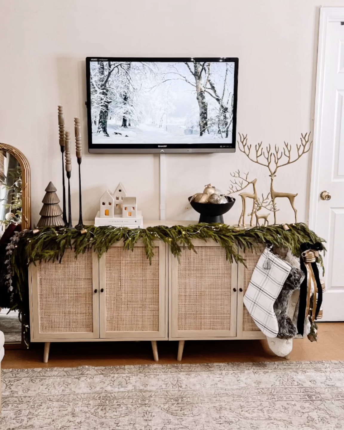 Tv console, console table, accent Cabinet, tv stand, holiday decor, stocking, reindeer, candle stick, village, ornaments, velvet ribbon, garland, 

#LTKSeasonal #LTKhome #LTKHoliday