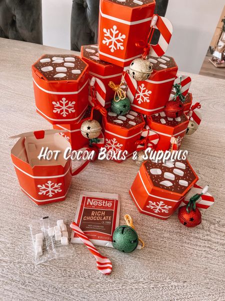 Hot cocoa boxes and supplies. Hot chocolate cups. Candy cane spoons  