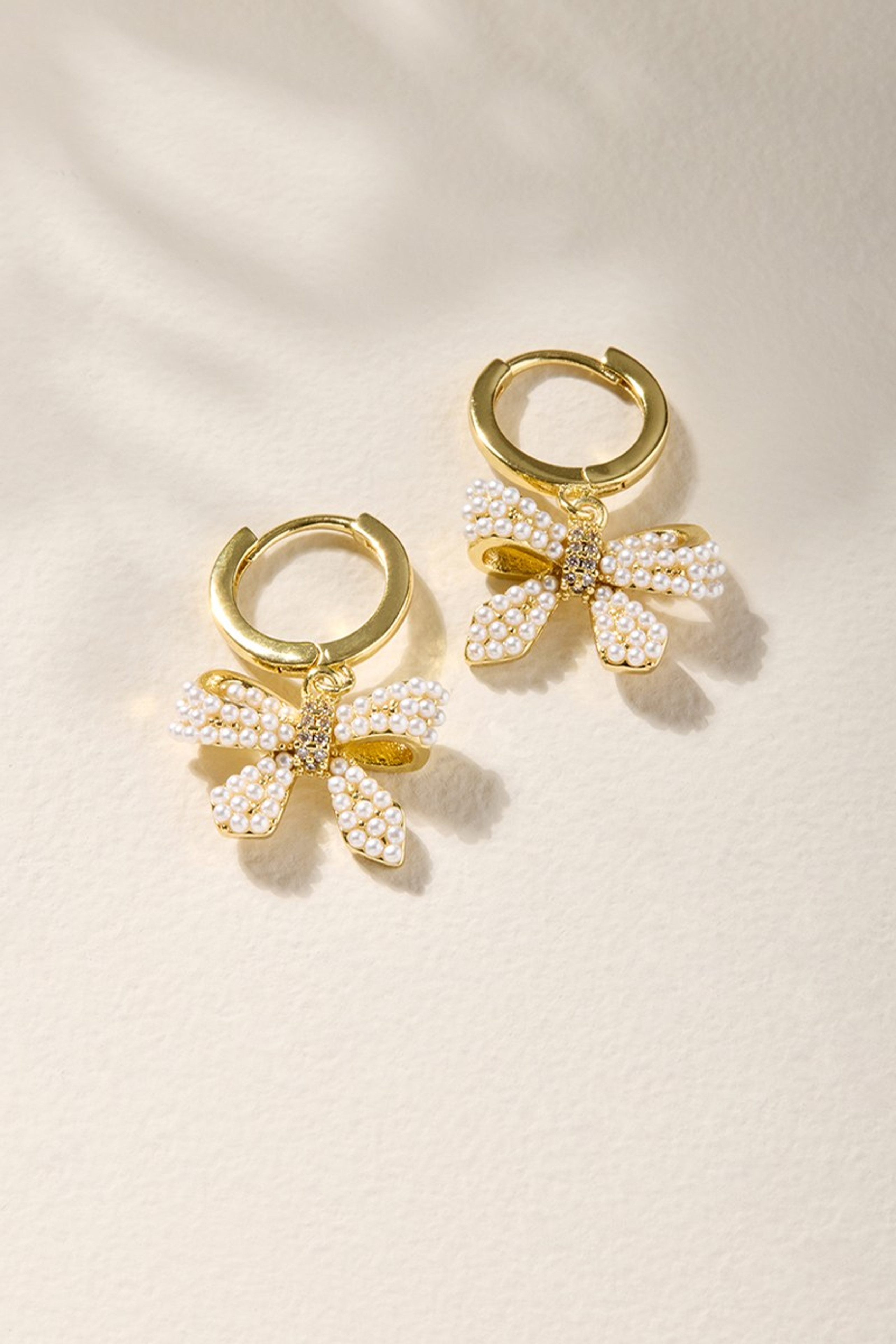 Holly Pearl Bow Charm Earrings | Francesca's