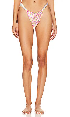 Kulani Kinis Ruched Thong Bikini Bottom in Champagne Aura from Revolve.com | Revolve Clothing (Global)