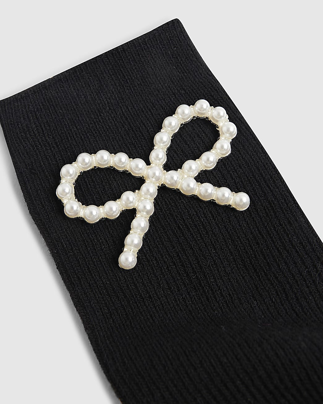Black Pearl Bow Detail Ribbed Socks | River Island UK & IE