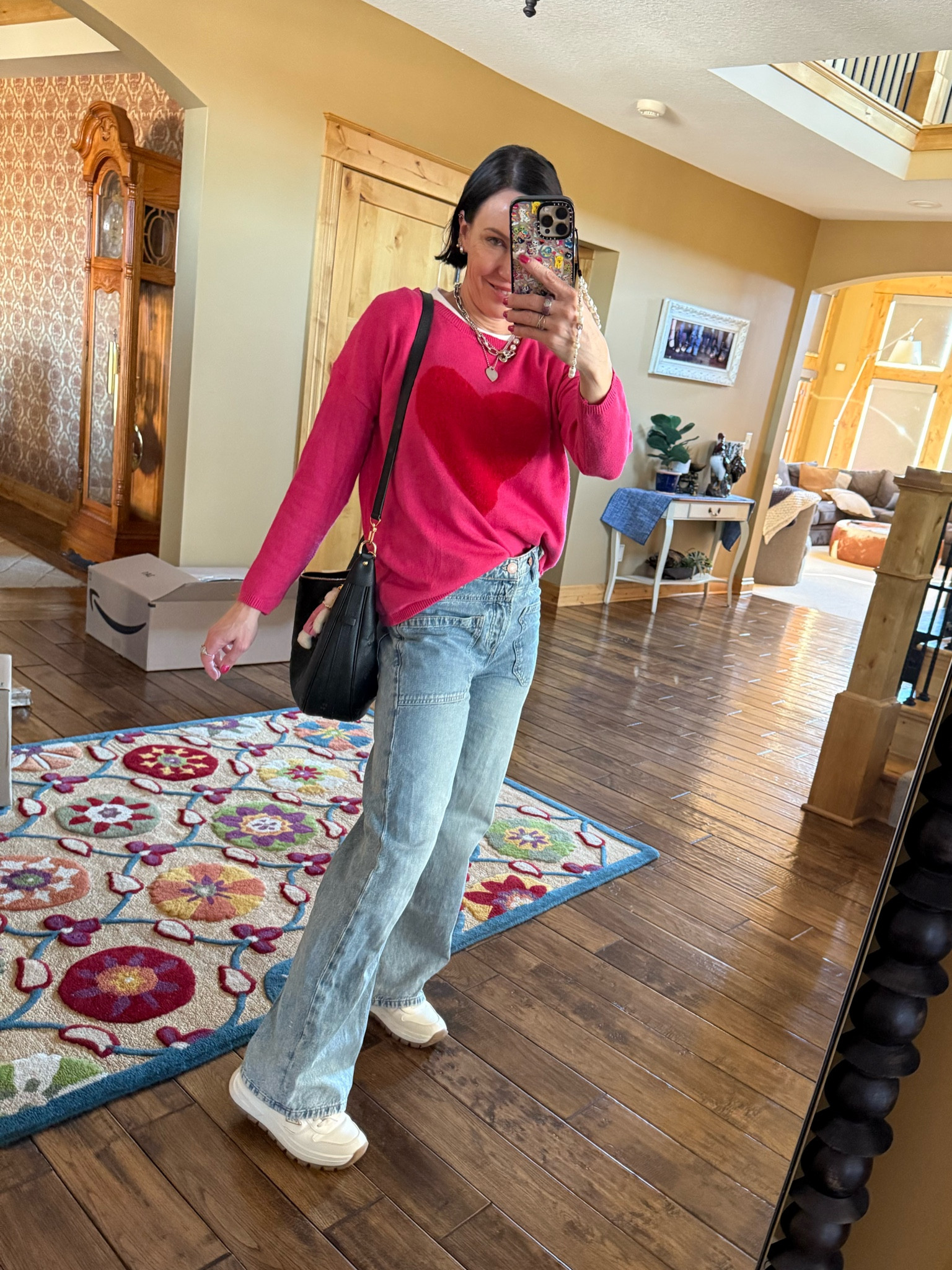 Outfit situation 
Free people jeans, Prada sneakers, pink heart sweater 

Casual, winter outfit 

#LTKStyleTip #LTKOver40 #LTKWatchNow