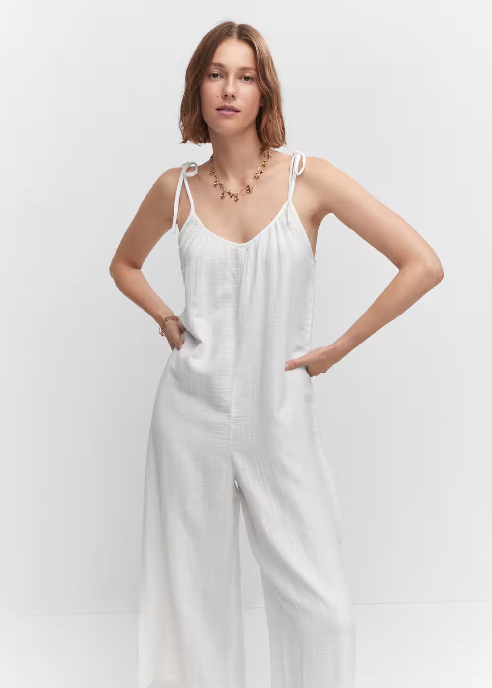 Textured jumpsuit with bows | MANGO (US)