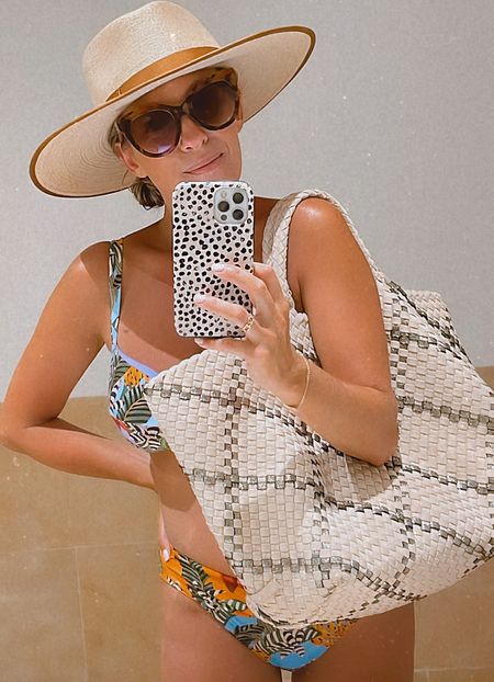 The best beach bag for your getaway! Lightweight, flexible + mom friendly. 
#getawayoutfit #beachbag #naghedi #naghedinyc #stbarthslargetote #stbarthstote #vacationoutfit #bathingsuit #rancherhat #brixton #vacationstyle #beachtote #bloomingdales #momstyle #traveloutfit 

#LTKstyletip #LTKswim #LTKtravel