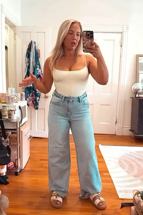 Everyday cute summer to fall transitional outfit! 🤍

Really into my new palazzo jeans - they are my first pair. Wearing a size 26, I had to hem the jeans. Stretch denim & super comfortable! 

🫶🏻 my top is $6.99 and comes in a few different color options. Versatile and you can pair with a skirt too. 

🎉 My shoes are Birk dupes! Raffia white and cream option that are the cutest for summer. 

#LTKFindsUnder100 #LTKSaleAlert #LTKVideo