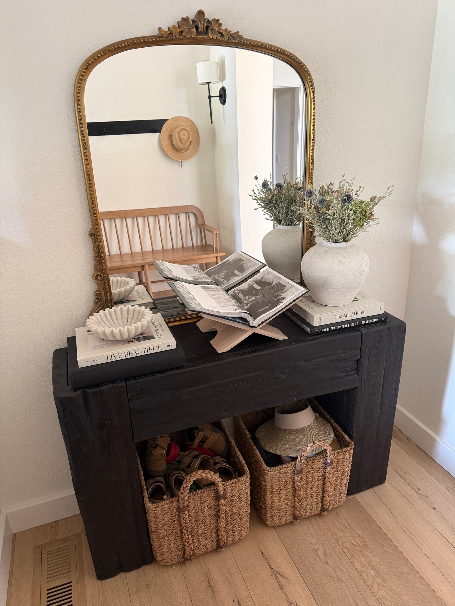 Entry console table styling details 👏🏻

Home decor
Mirror 
Coffee table books

#LTKHome