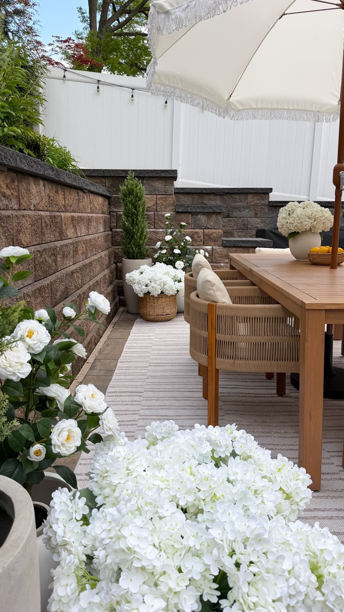 Sometimes it’s the smallest corners that make a space feel truly finished. 🤍🌿

I wanted this outdoor dining area to feel soft, elevated, and layered… and these pieces brought everything together so beautifully. From the striped outdoor rug to the woven dining chairs and all the faux florals, every detail added that cozy resort-inspired feel I was going for.

Linked all my outdoor favorites here ✨

#Wayfair #WayfairPartner #Outdoor #WishYouWereHere