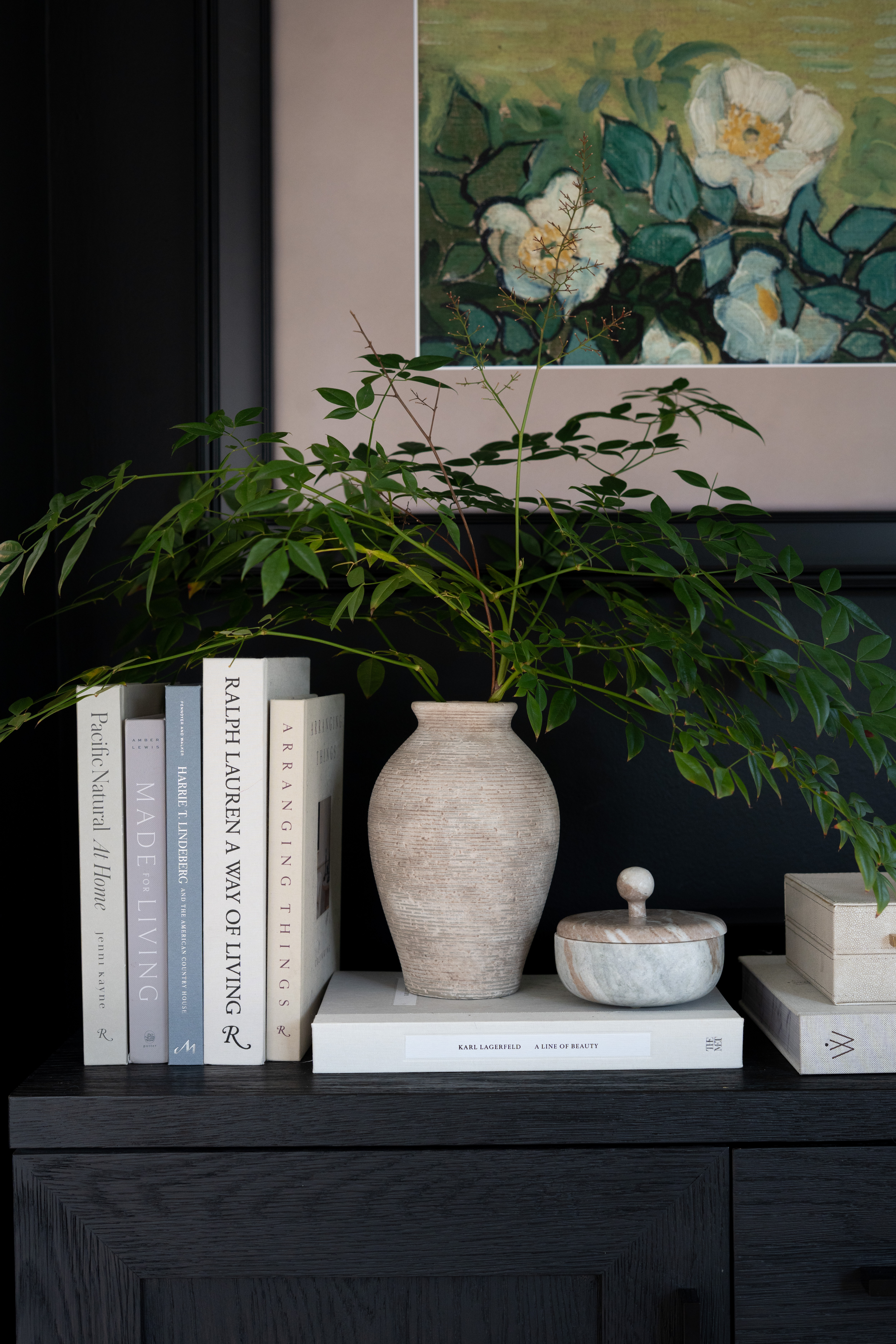 There’s something about layering books, greenery, and sculptural decor that makes a console feel finished. The textures, tones, and artwork all work together here, and the Frame TV above blends right in with the rest of the wall.  

 #LTKSpringSale #LTKmomlife #LTKHome