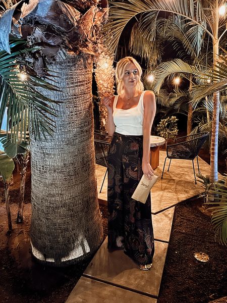 Farm Rio wide leg pants, square neck white tank top, layered white necklaces, YSL clutch, and white espadrilles. 

#LTKtravel #LTKFind #LTKstyletip