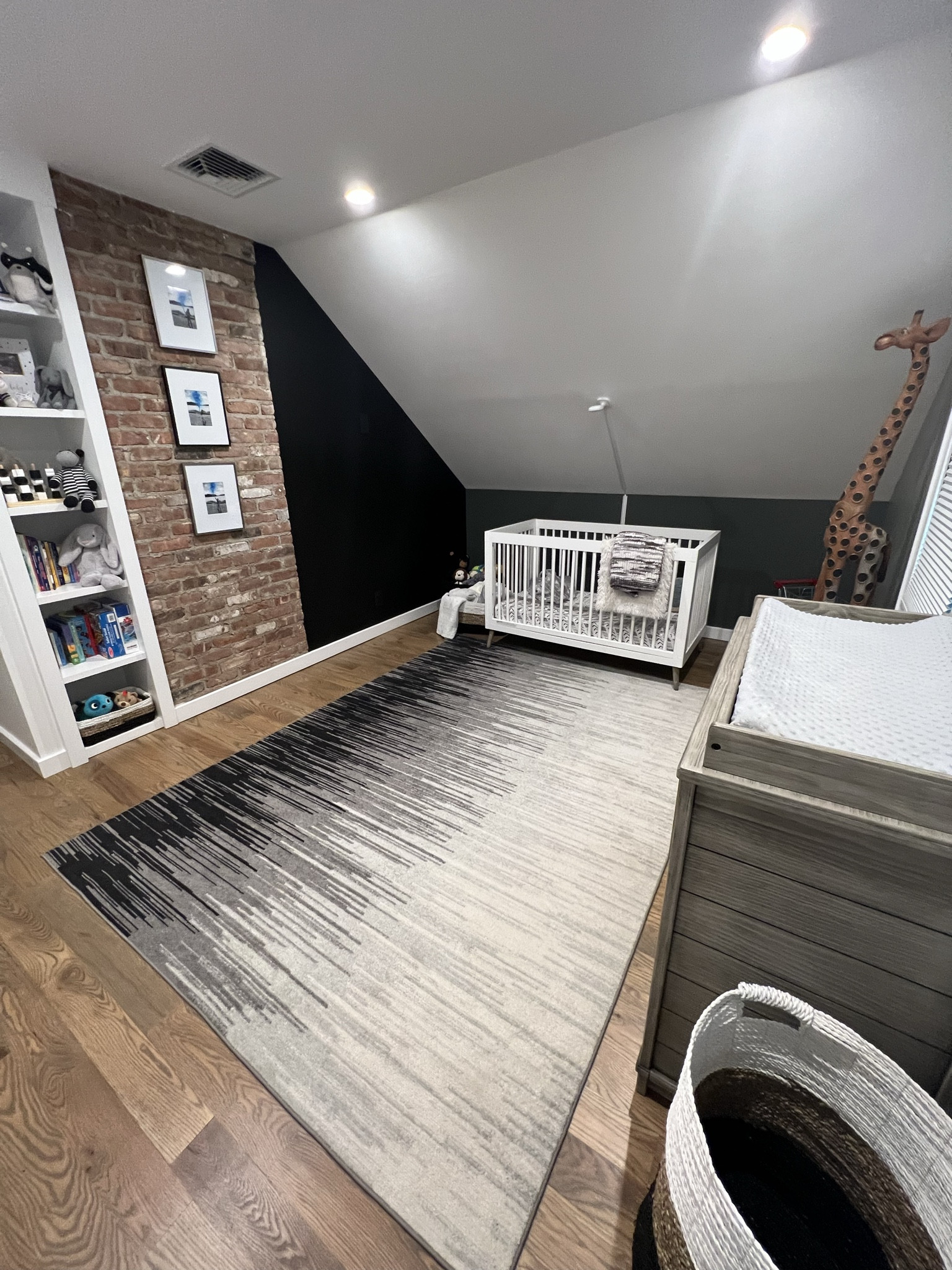 Non traditional nursery. Ombre walls, ombre rug and wallpaper and brick incorporated into the design. 

#kidsdecor #playroom #kidsinteriors #nursery #kidsroom #genderneutral #educationaltoys #beigelover #neutraldecor #babyroom #kidsroominspo #kidsroominspiration #babyroom #babydecor 

#LTKbaby #LTKhome #LTKkids