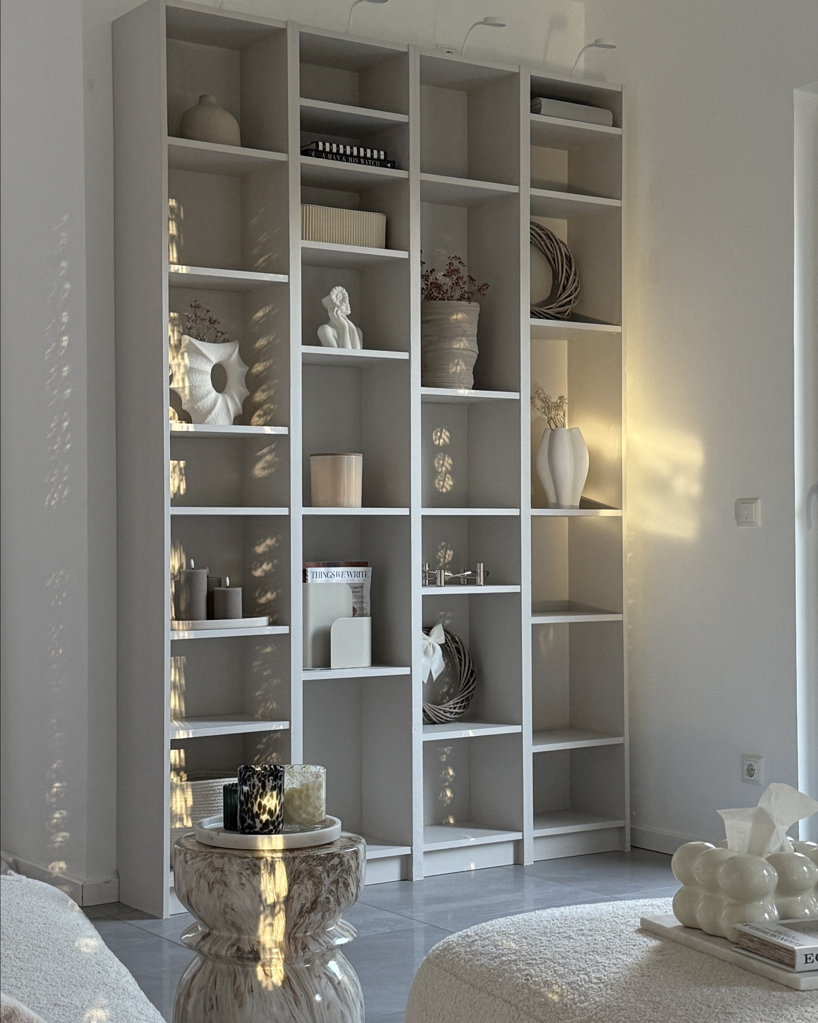 SHOP MY IKEA DIY #diy
So wie es bei uns steht braucht ihr vier schmale Billy Regale & die Aufsätze dazu 
[40x28x202]

*Aufbauen & miteinander verschrauben

*Regalböden beliebig einsetzen 
[Tipp überlegt euch vorher welche Deko Pieces in dem Schrank ihren Platz finden sollen]

*die Löcher & Schlitze zwischen den Regalen spachteln & schleifen 
[bitte nicht zu viel spachteln / ich war dann echt zu faul alles wieder zu schleifen]
Ich hatte die Schnellspachtel Tube für Holz & lackierte Flächen benutzt

* Grundieren [1x streichen]
zb Alpina Lack Grundierung 

ggf nochmal unebene Stellen schleifen

*Streichen mit eurer Lieblingsfarbe
zb Alpina Edelmatter Lack „Elegante Gelassenheit“
ich habe zweimal gestrichen ggf ein paar Stellen nochmal ein drittes Mal 
Ja und das war’s dann auch Schrankbeleuchtung oben drauf & Thats it ✨


#LTKeurope #LTKhome #LTKdeutschland