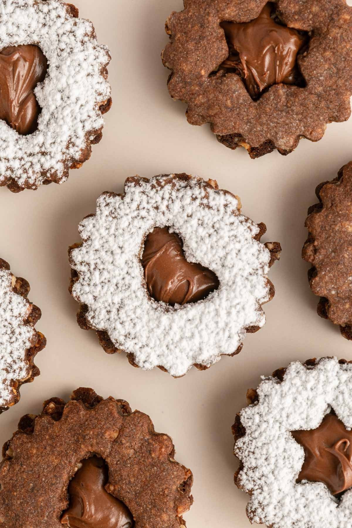 Making Christmas cookies from scratch with a chocolate hazelnut cookie sandwich recipe. They’re kind of like Linzer cookies. Baking - entertainingg

#LTKFamily #LTKfoodie #LTKHoliday