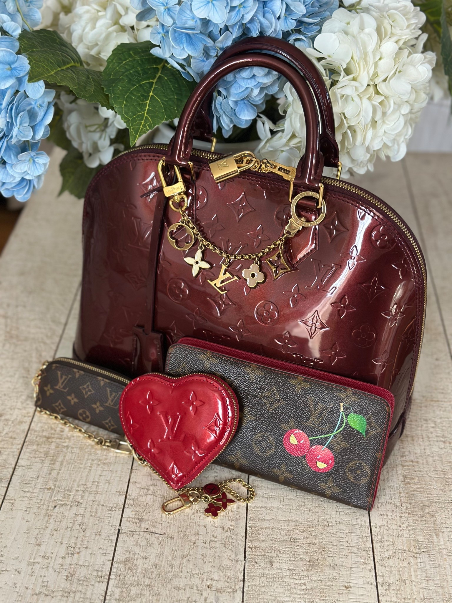 Perfect bag for this week! The PM Alma BB in grenadine accessorized with the LV bag chain, lipstick case, red heart coin and cerises wallet. 

#LTKValentine #LTKSeasonal #LTKPetite