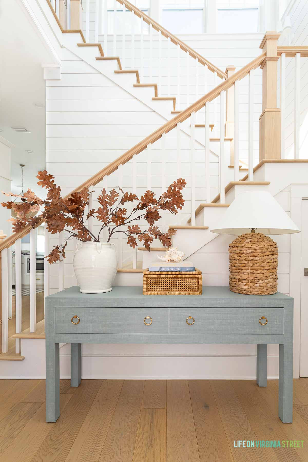 Fall entryway coastal home // modern coastal Florida home // fall entryway // faux stems // console table  

 #LTKSeasonal #LTKHome #LTKStyleTip