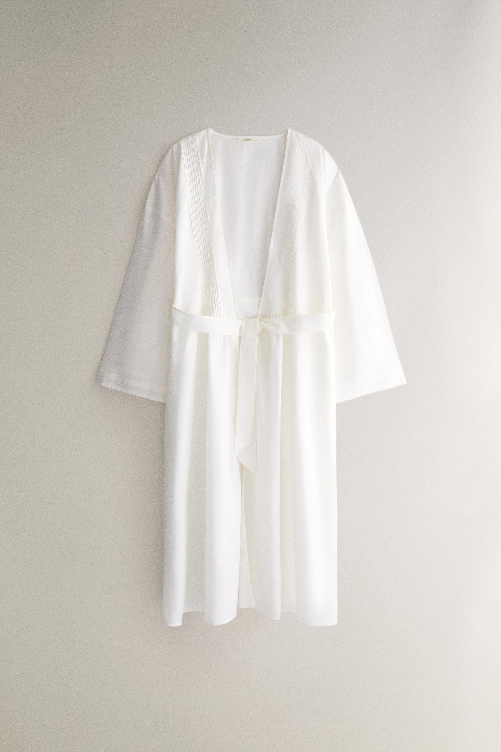 Cotton robe. Wrap-front design featuring three-quarter sleeves, pintuck detailing on the front, a... | Zara US