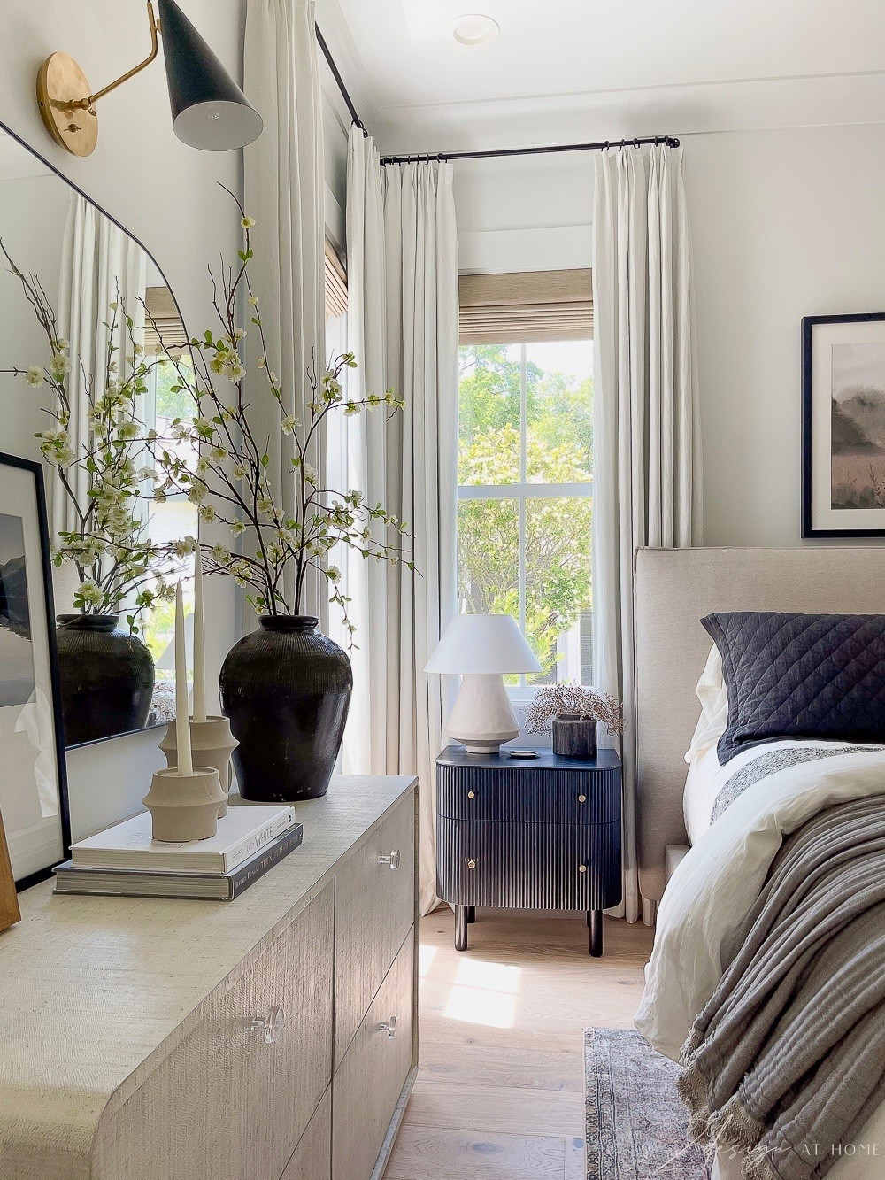 Bedroom, bedroom decor, black nighstands, neutral bedding, white curtains, two pages, brown vase, Roman shades, dresser mirror, bedroom mirror, bed pillows, faux stems, faux flowers, coffee table books

#LTKHome #LTKSeasonal #LTKSaleAlert