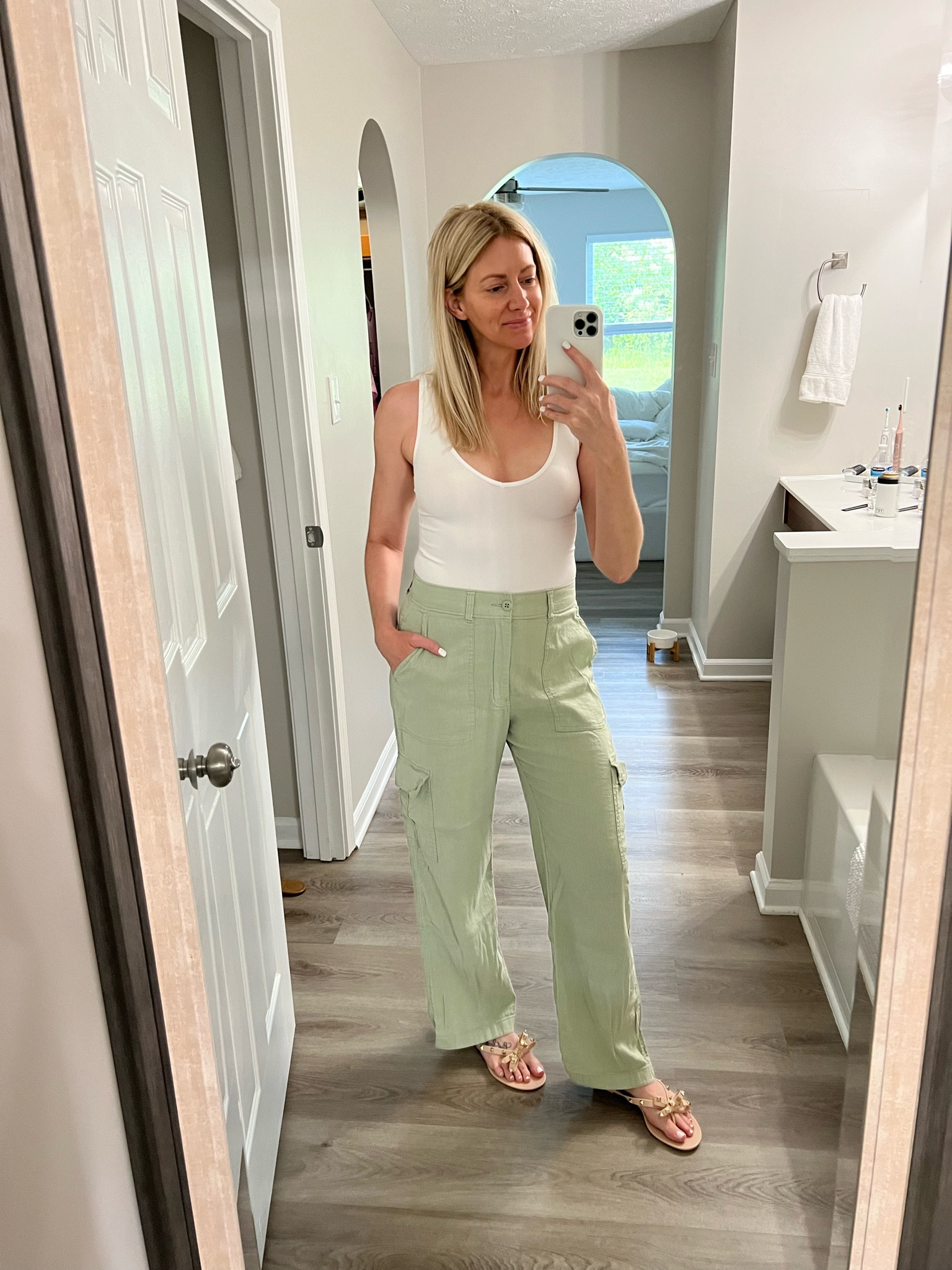 Linen cargo pants on sale (shown in your cart)! Valentino sandal dupes. Love these pants paired with a white bodysuit and my go-to nippes that I wear anytime I wear a bodysuit. 

#LTKshoecrush #LTKunder50 #LTKsalealert