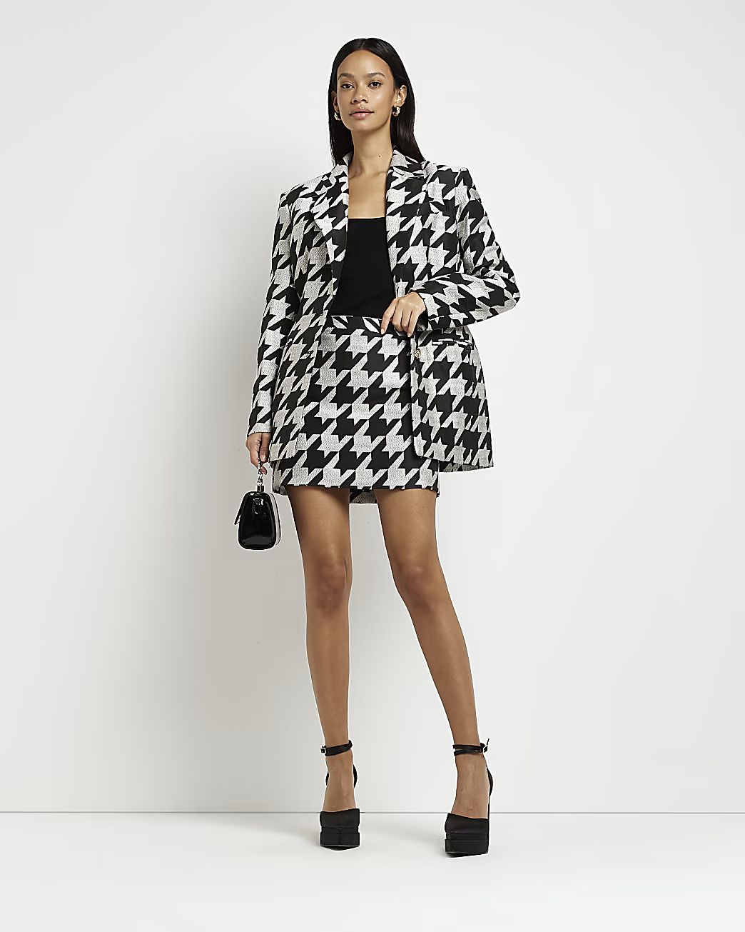 Black dogtooth mini skirt | River Island (UK & IE)