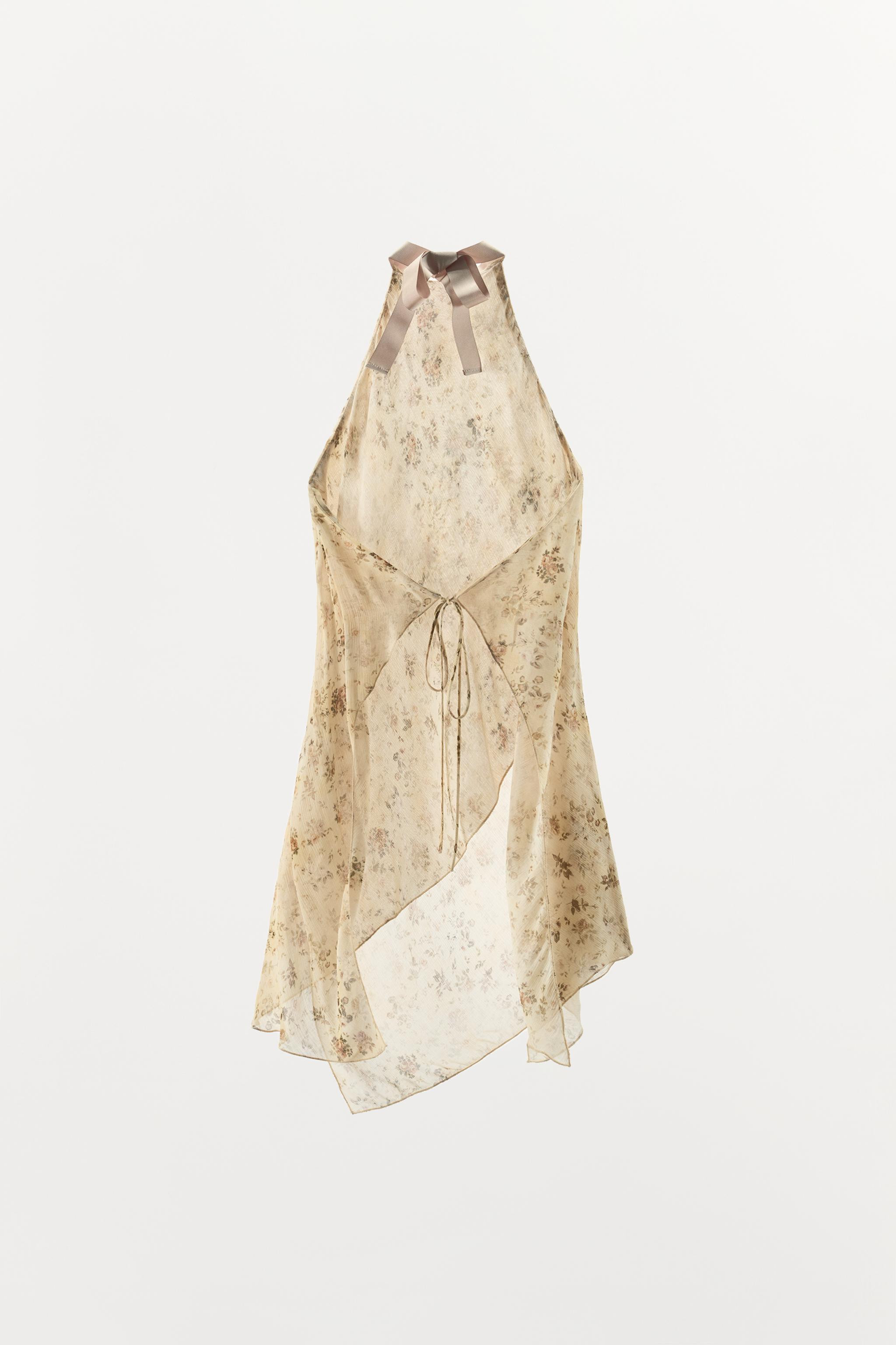 Top made from 100% viscose fabric. Halter neck. Open back. Tie fastening at the neck and back. | Zara UK