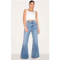 Petite Mid Blue Wash Denim Extreme Flare Jeans | PrettyLittleThing US