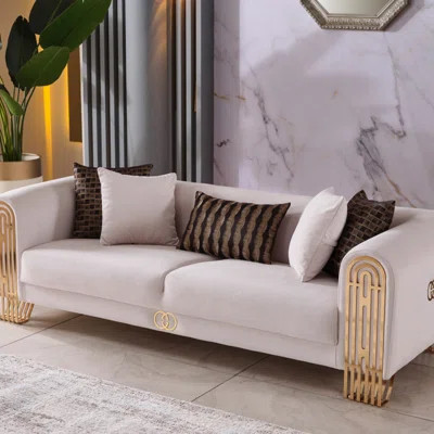 Modern Glam Velvet Sofa With Sculpted Gold Legs â 94" Wide Cream Luxury Couch With Designer-Inspired Detailing & Accent Pillows | Wayfair North America