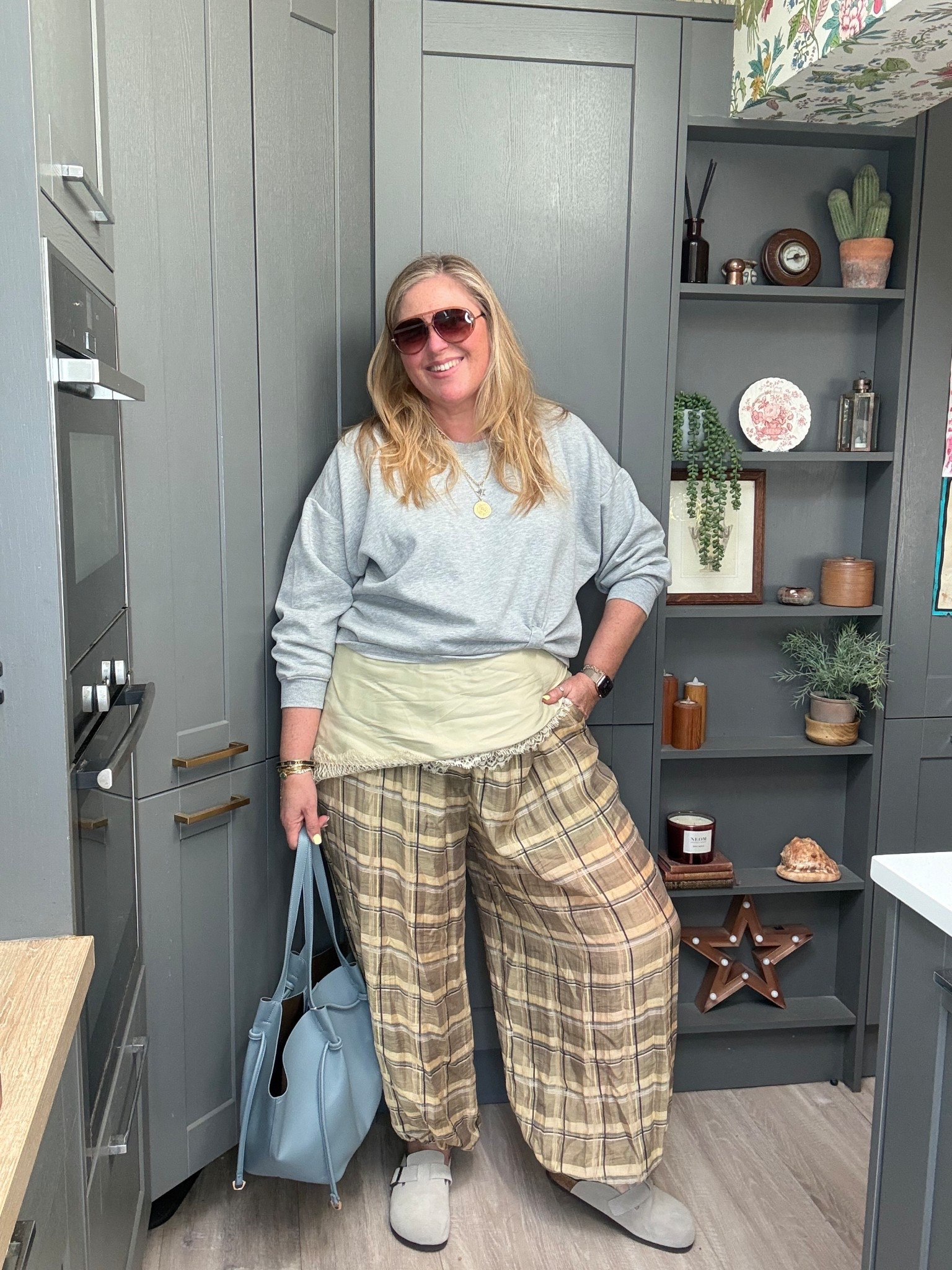 Balloon trousers, sweatshirt, lace top, mules, blue bag, sunglasses 

#LTKspring #LTKplussize #LTKstyletip