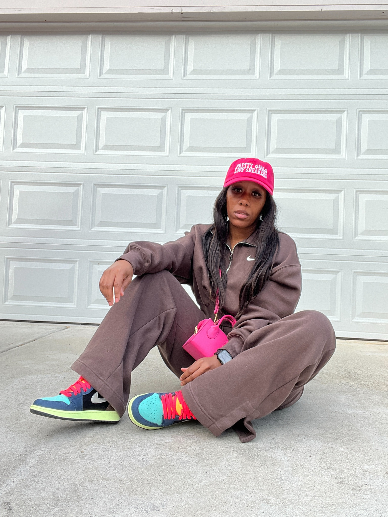 Nike phoenix fleece sweatsuit styles with a pink hat, pink crossbody purse, and Jordan 1 Tokyo bio hack sneakers 

#LTKStyleTip #LTKShoeCrush #LTKSeasonal