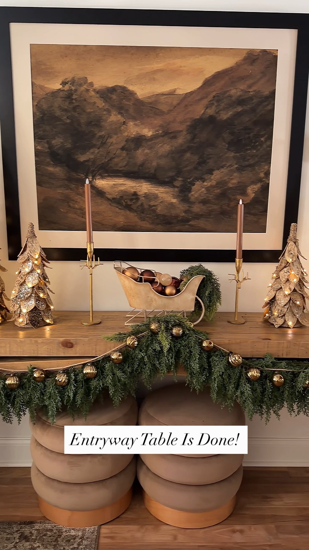The entryway is the first thing your guests see, so it’s gotta make a statement! 🎄
This year I added some lush garland, gold shatterproof bell garland, a beautiful gold sleigh, reindeer candlesticks, and my favorite...the birch trees! The birch trees light up and come with a timer. They are my favorite thing to use year after year.  
It all came together to make the coziest, most festive welcome! 

P.S. before applying your command hooks, dust the surface. I placed  them at an angle, pressed down and let them sit overnight. These things aren’t budging. Also there is no damage to your walls or furniture when it comes time to removing them! 
