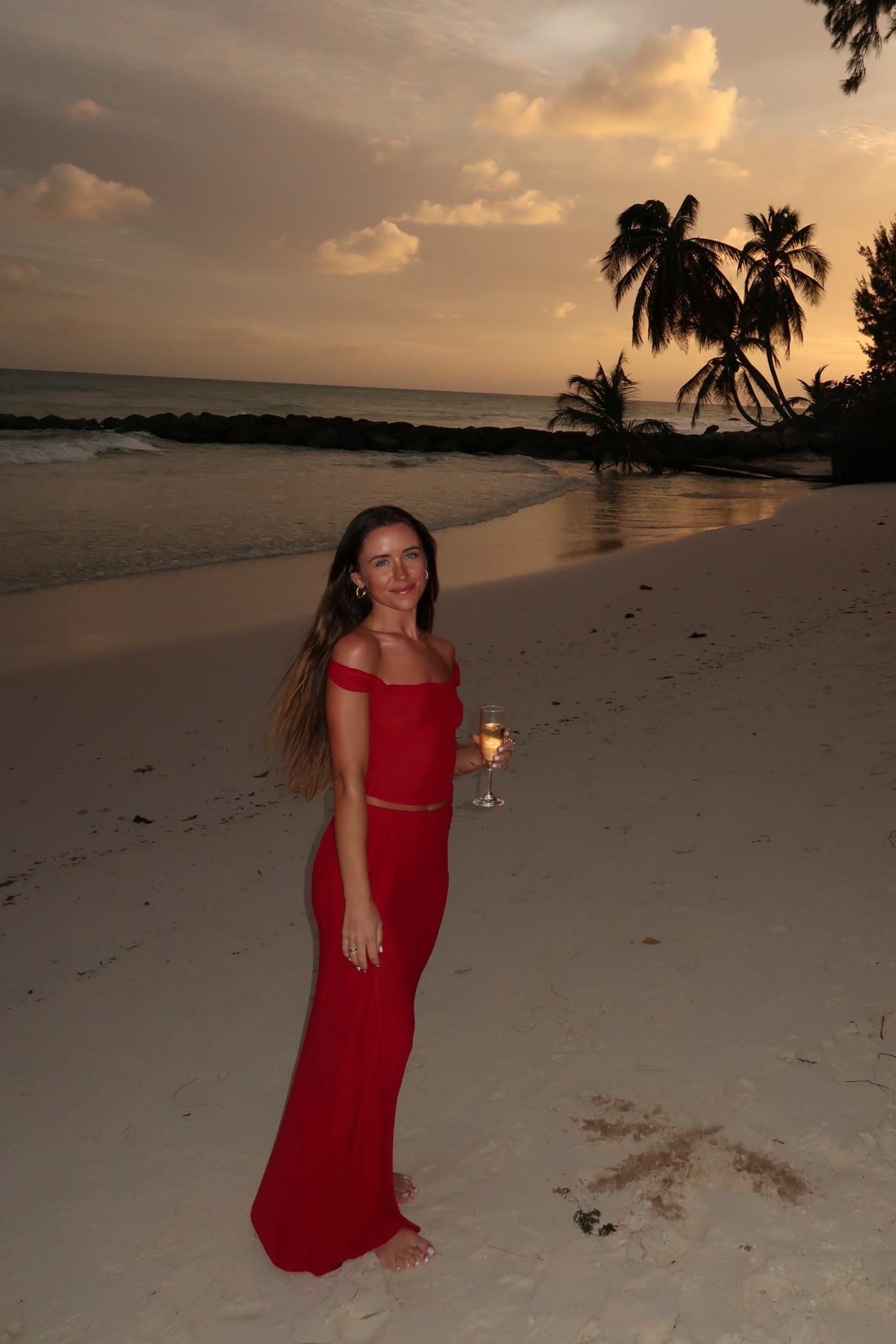 sunset vacation outfit ♥️ this red set from meshki was so comfortable and perfect for sunset / dinner. wearing an XS in the top and bottom. The top can be worn as a halter or off the shoulder (adjustable straps) and the maxi skirt can double as a swim coverup 
