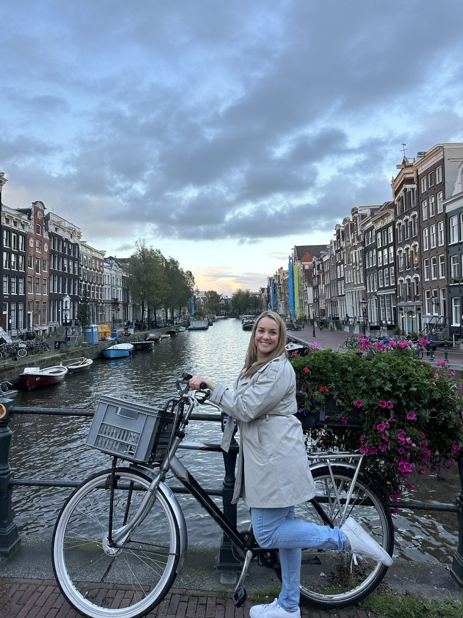 A trench coat, comfy jeans and white sneakers are my go-to outfit for a cool evening in Amsterdam. The sneakers are the PUMAs I keep packing, and I've linked pieces similar to the rest of this look. 

 #amsterdam #travelstyle #traveloutfit #fallstyle #solotravel #LTKootd #LTKOver40 #LTKTravel