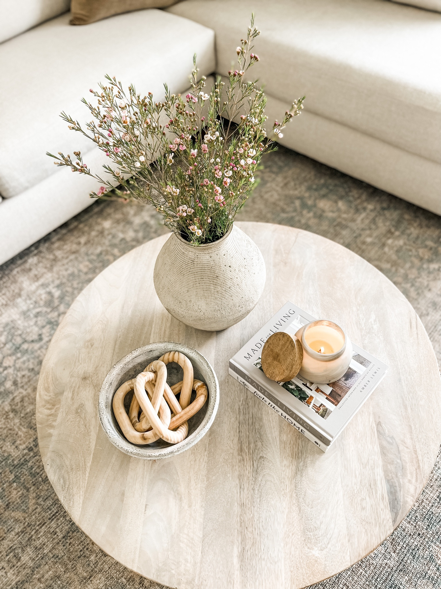 Spring vibes in the living room. 
Coffee table decor, living room rug, loloi rug, round coffee table. 

#LTKhome #LTKSeasonal