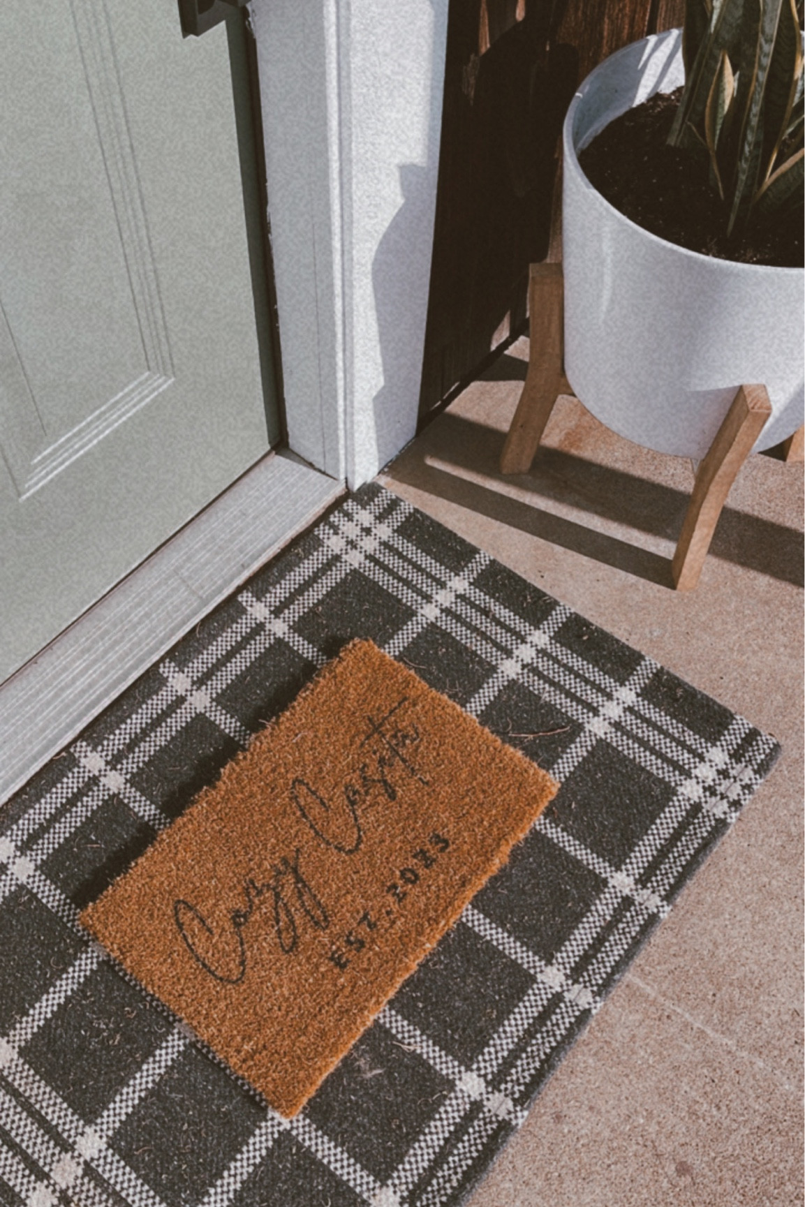 Cute entryway inspo! ✨ we created this custom door mat for our AirBNB! We also painted the door and added cute planters! Need ideas to refresh your front patio? Find some ideas here 🫶🏽 

#LTKunder100 #LTKhome #LTKSeasonal