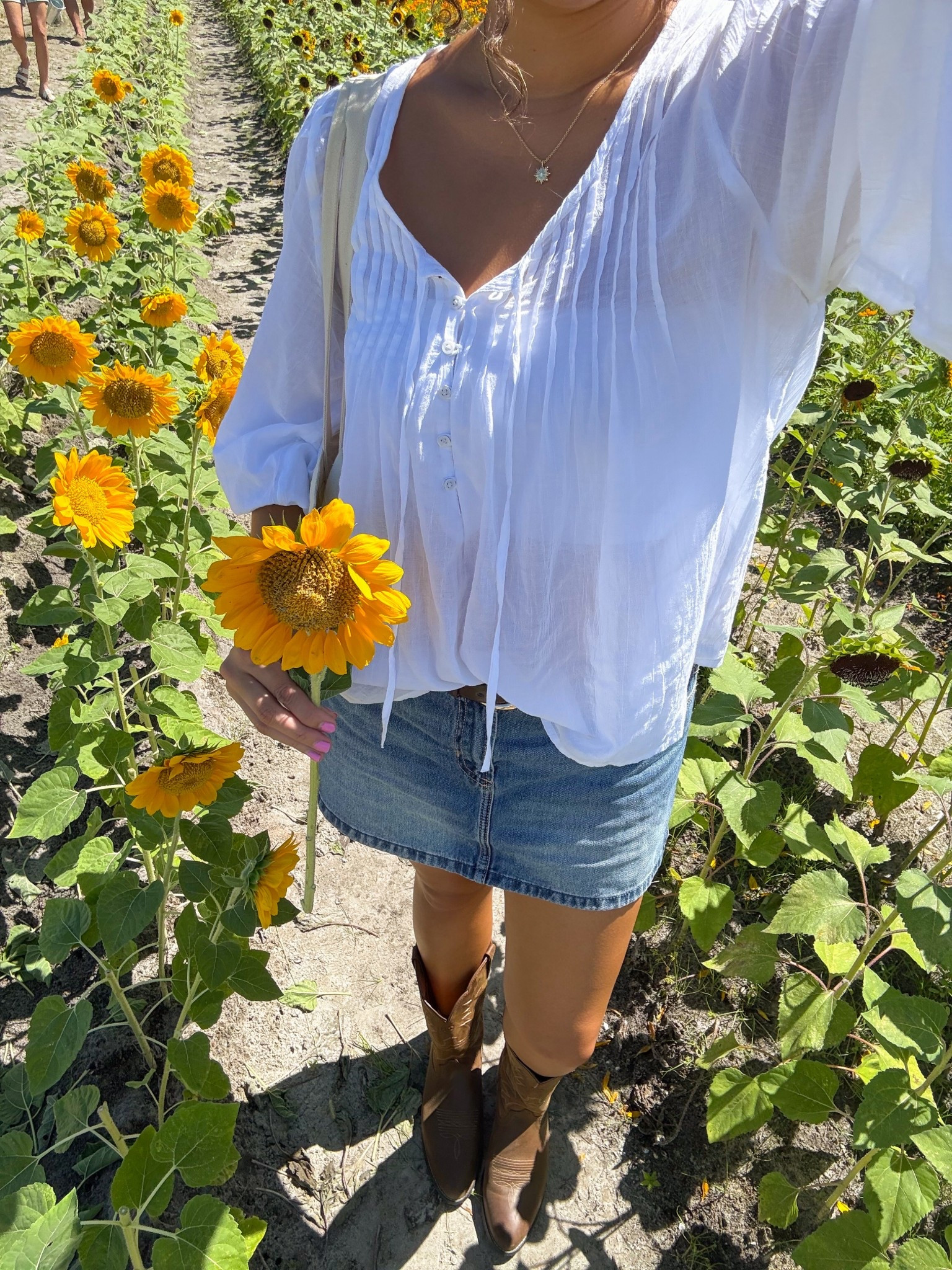 sunflower field outfit of the day

cowboy boots, denim skirt, white blousee

#LTKShoeCrush #LTKSeasonal #LTKFallSale