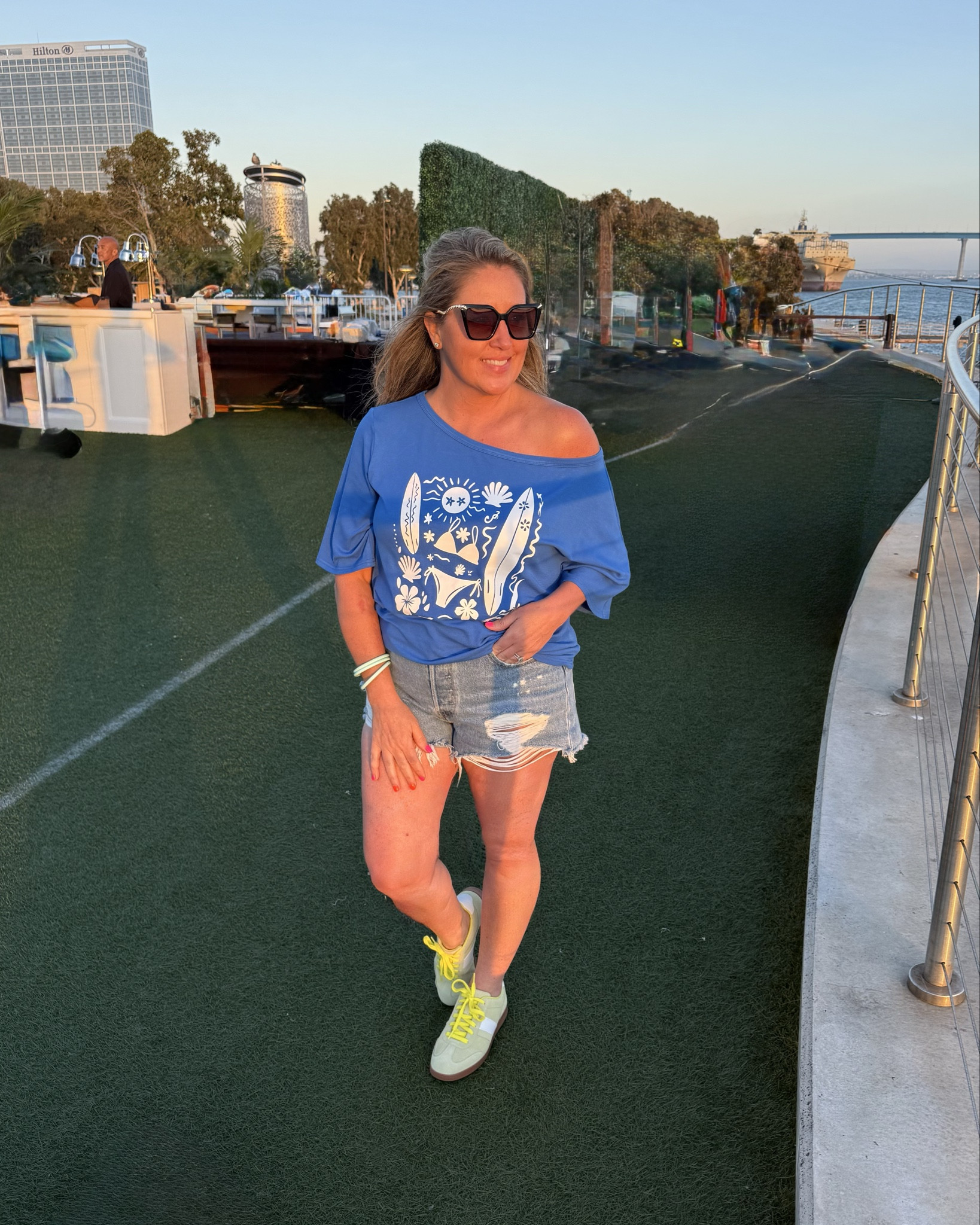 Casual Beach OOTD💙 @Cupshe 

This off the shoulder tee shirt is super soft and effortless chic! I paired this top with these flattering distressed denim shorts✅

Lime sneakers @Clarks US are sold out, but I did link the same pair in sky blue🩵

#LTKdayinmylife #LTKootd #LTKOver40