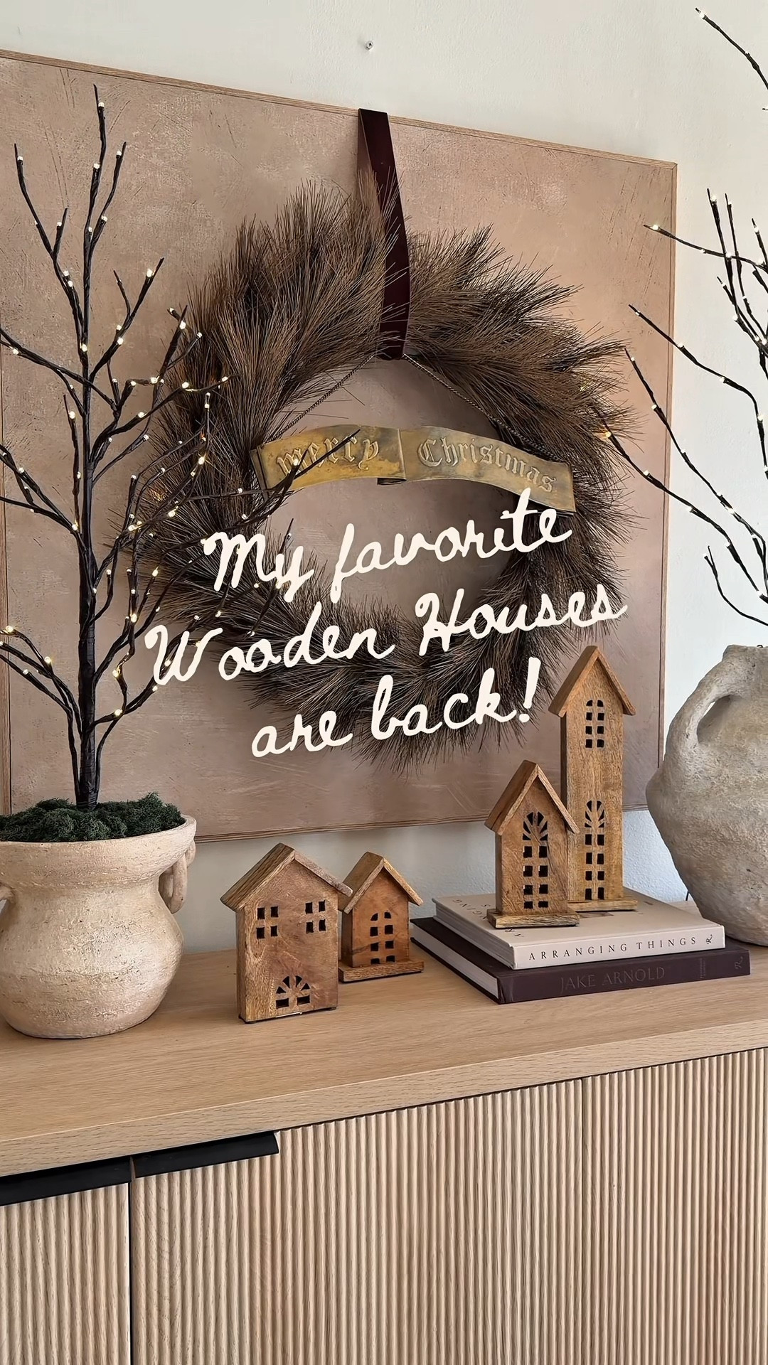 My favorite wooden Christmas houses are BACK this year and still under $25! They’re one of my most-asked-about holiday decor pieces because they look like something from a little European Christmas village. Simple, neutral, and so cozy for styling shelves, consoles, or mantels.

wooden houses, wooden Christmas houses, neutral Christmas decor, cozy Christmas pieces, Christmas village decor, cottage Christmas, organic modern Christmas, affordable Christmas decor, under $25 decor, holiday home finds, seasonal home styling, bestselling Christmas decor, cozy home finds, Christmas LTK, neutral holiday styling, cottagecore Christmas, rustic Christmas decor, Scandinavian Christmas vibes, Christmas console table decor

#LTKCyberWeek #LTKHoliday #LTKHome