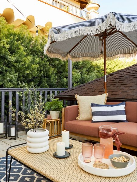 Outdoor upgrade: we stuck to a strict color palette of rust, navy, and cream for this comfortable patio makeover! Add in a few natural elements, like a vintage rattan table or wicker bench, to bring the whole look together. 

#LTKhome #LTKfamily #LTKSeasonal