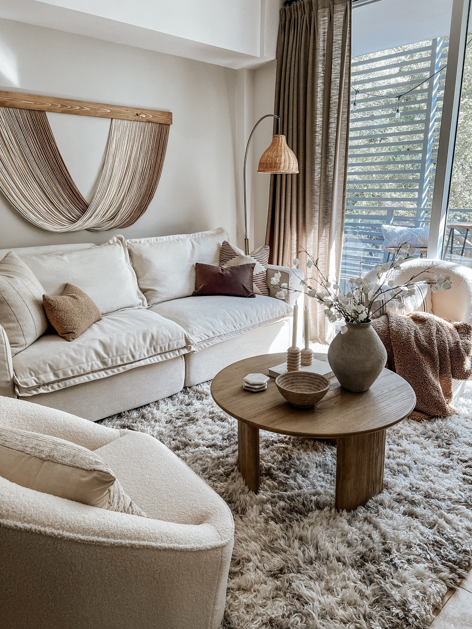 spring views in my cozy neutral living room

Sofa coupon code: groundedinneut

boho organic modern, fiber art, pillows, floor lamp, neutral decor, living room decor, area rug, coffee table, accent chair, vase, candle holders 

#LTKhome