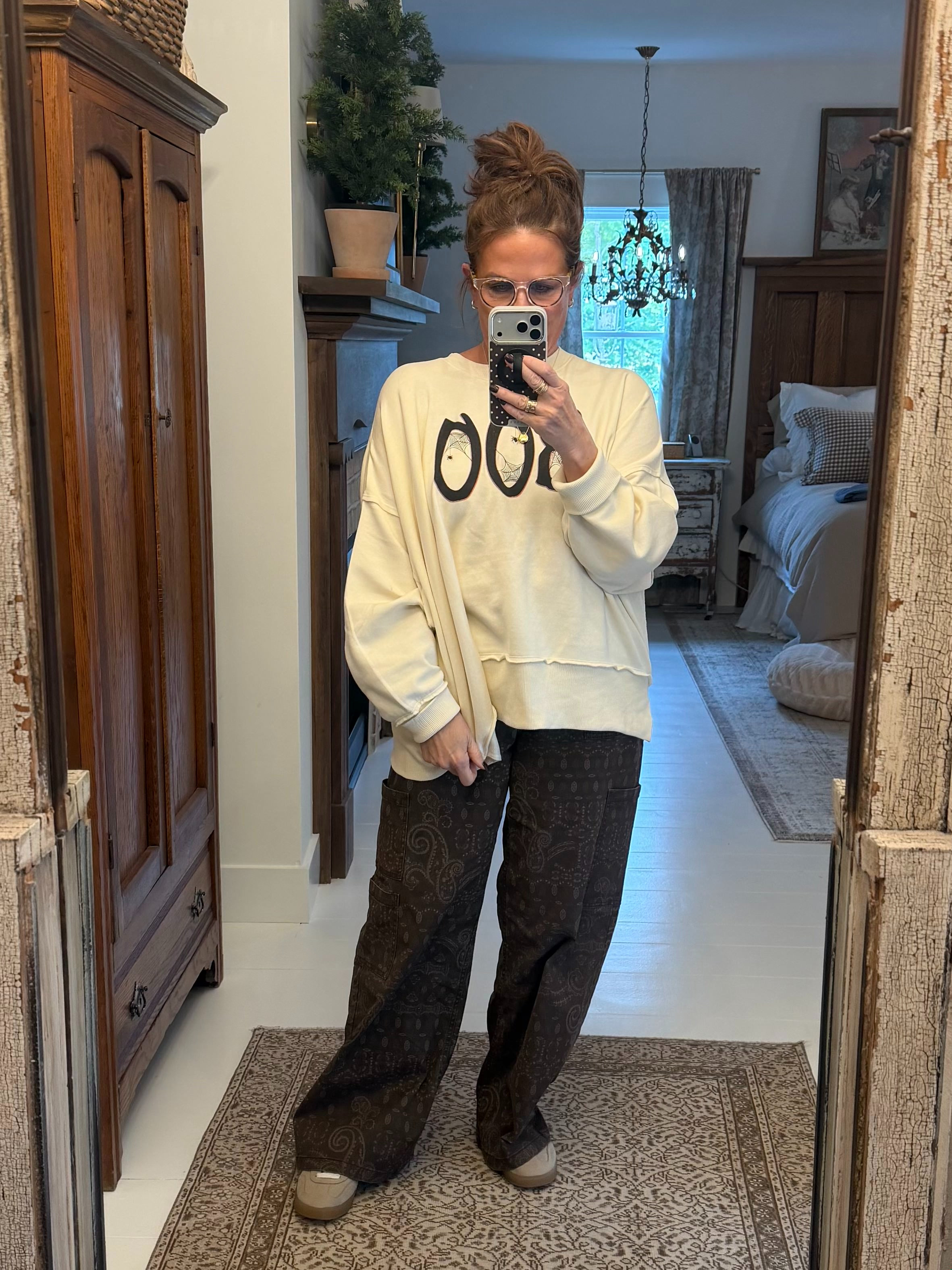 My Walmart outfit of the day includes my new boo graphic sweatshirt and patterned wide leg pants.  

 #LTKSeasonal #LTKMidsize