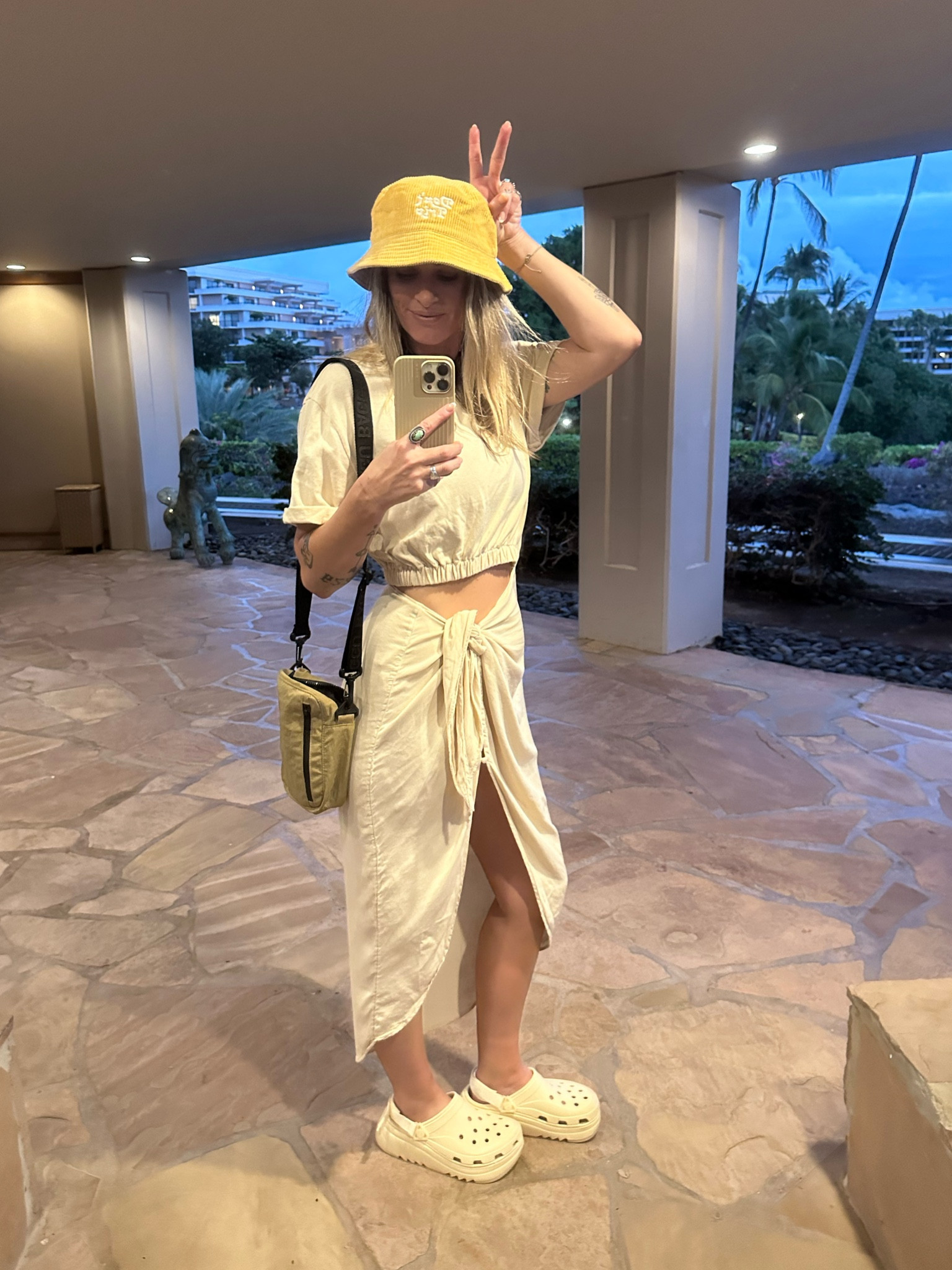 emily w recker wears a free people dress for a welcome dinner luau in hawaii with platform crocs and a bucket hat. fun hawaii fit🌺🫶🌴✨🌊

#LTKfindsunder100 #LTKstyletip #LTKfindsunder50