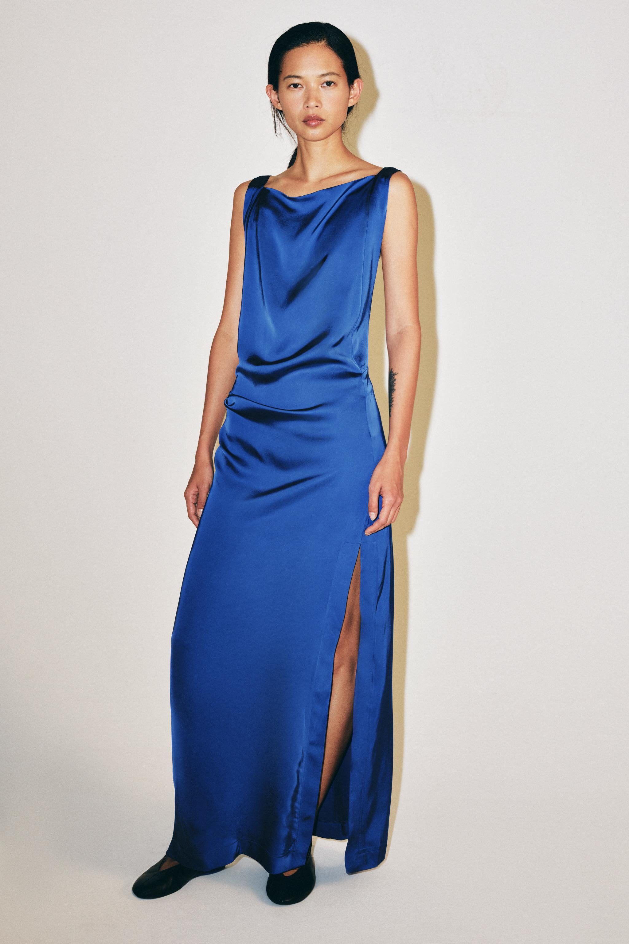 ZARA WOMAN COLLECTIONDress made from viscose fabric. Features a fluid neckline and wide sleeveles... | Zara US
