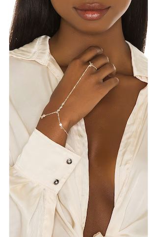 Lili Claspe Anais Hand Chain in Gold from Revolve.com | Revolve Clothing (Global)