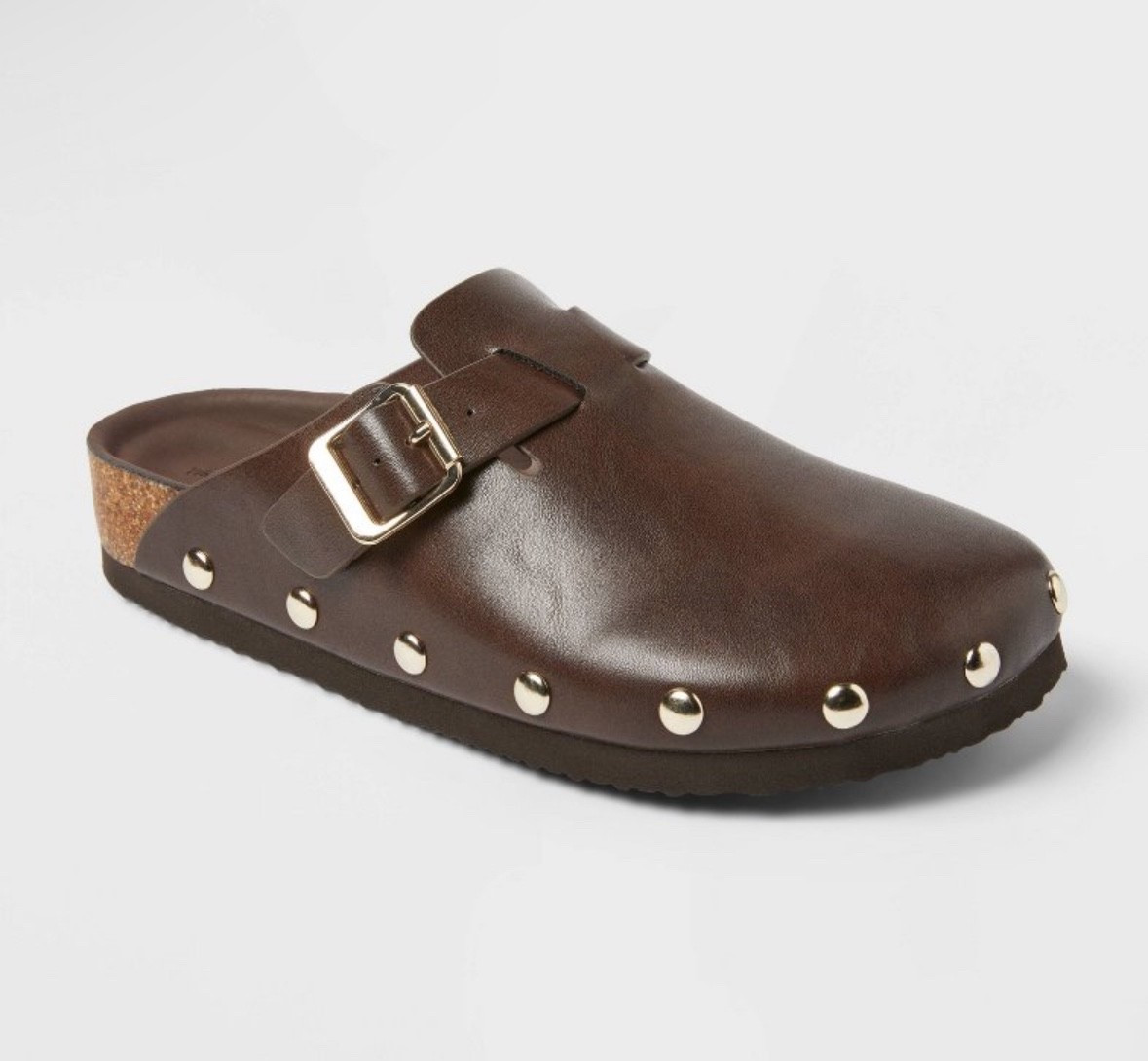 A comfy-chic twist on a classic clog These studded brown slip-ons from Target are a fall capsule closet must. Style them with denim, cozy knits, or a relaxed set for an effortless everyday look. Under $40 and insanely comfortable 👏
