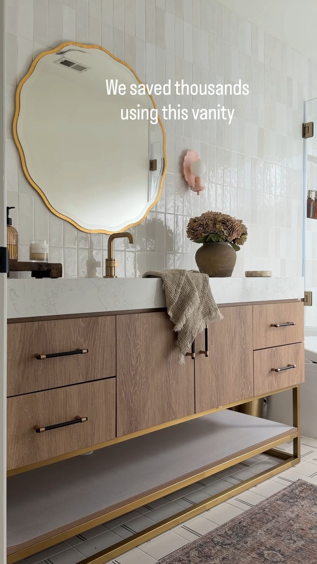 This vanity looks so custom and saved our clients so much $$$$. Anytime you can buy a vanity with a countertop you’ll save thousands since you don’t have to buy a countertop plus pay for fabrication. Wayfair is always my go to for custom looking vanities and anything home decor related. Be sure to check it out! 

#ad #wayfair @wayfair #wayfairpartner

 Wood vanity oval capsule, mirror, rectangle, mirror, medicine cabinet, brass faucets, brass hardware, bra, shower system, white soaking tub bra, sconces, bubble chandelier, bathroom, accessories, white tile, gray tile marble tile sink rug runner



#LTKHome