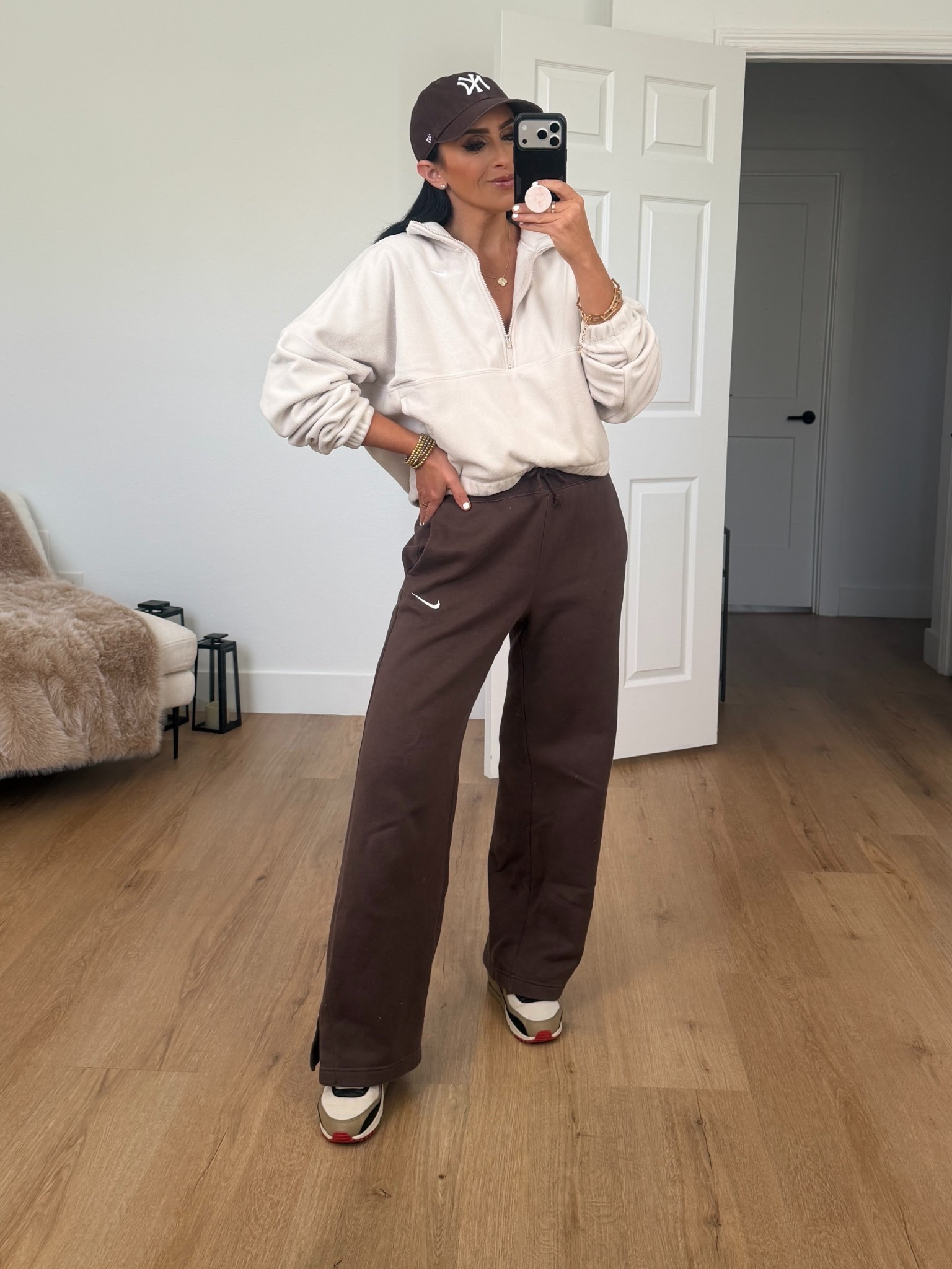 Nike One Women's Therma-FIT Oversized 1/2-Zip Fleece Top wearing size small. Nike Sportswear Phoenix Fleece Women's High-Waisted Wide-Leg Pants wearing size medium. 
